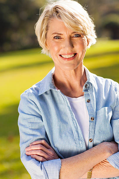 istock middle aged woman with arms crossed 469097161