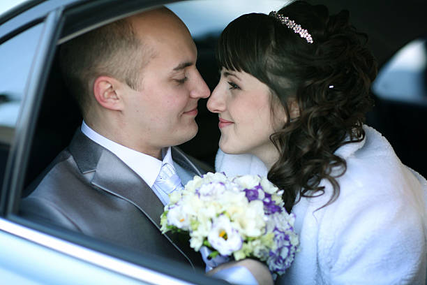 istock bride and groom in the car 469097794