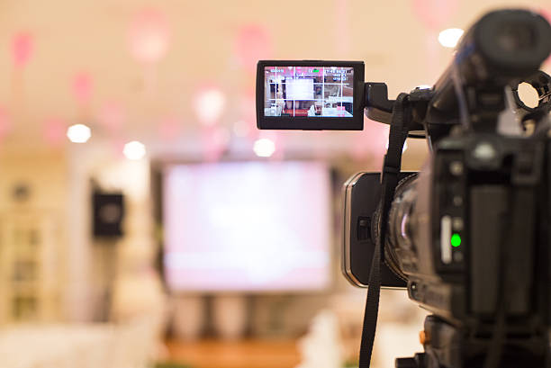 istock Video camera set up to film a presentation or event 469100728