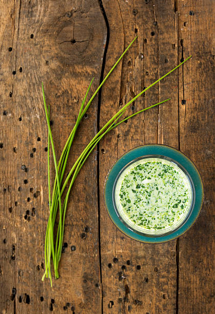 istock Summery chive Smoothie on old wood in green bowl 469101623