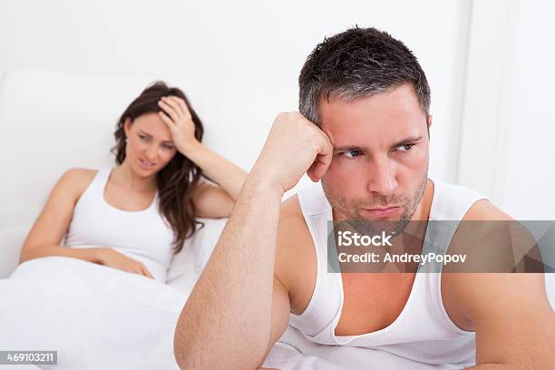 Frustrated Couple On Bed Stock Photo - Download Image Now - Accidents and Disasters, Adult, Adults Only