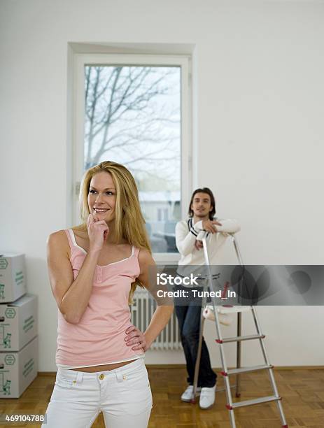 Couple Standing In New Flat Stock Photo - Download Image Now - 2015, Adult, Adults Only