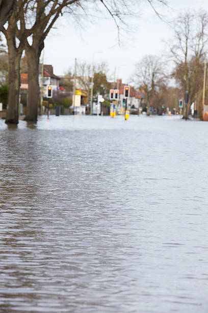 istock Flooded Urban Road With Traffic Lights 469106316