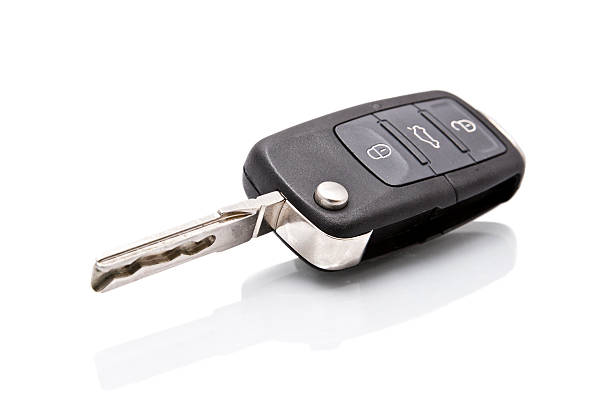 Open black and silver car key with buttons Car key isolated on white car key photos stock pictures, royalty-free photos & images