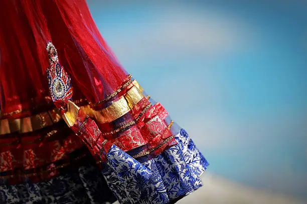 Photo of Indian colorful dress with beads crystals at culture festival market