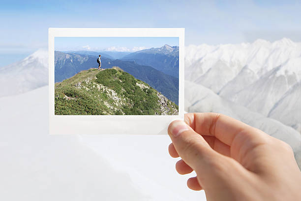 istock Person holding an instant photo 469109424