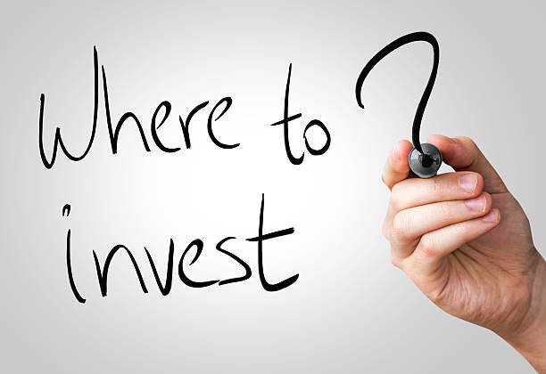 istock Where to invest hand writing on a transparent board 469110440