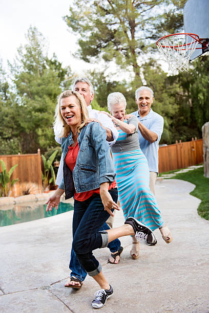 istock Group of seniors having an outdoors birthday party 469114380