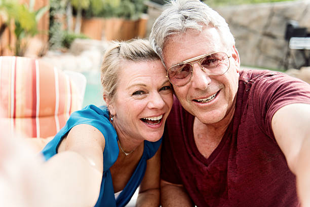 istock Mature couple in vacation, making selfie 469114400