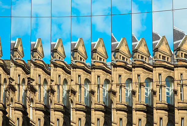 istock Old building reflected in new glass building, Leeds, West Yorkshire 469114478