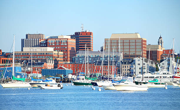 Portland Maine Portland Harbor and skyline at the western end of Casco Bay. Portland is the largest city in the state of Maine located on a penninsula extended into the scenic Casco Bay.  Portland is known for its maritime services, boutique shops,cobbleston streets, fishing piers, vibrant art district and fine dining. casco bay stock pictures, royalty-free photos & images