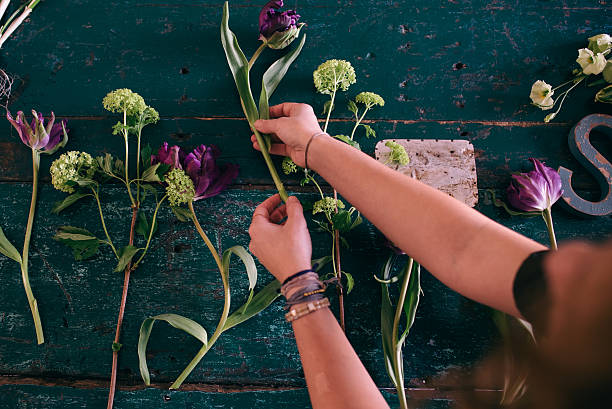 istock Florist workspace: woman making floral decorations 469115932