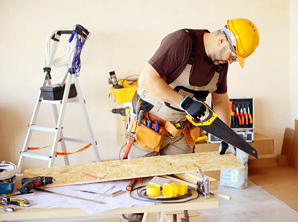 istock Male carpenter in working clothes in a construction workshop 469119378