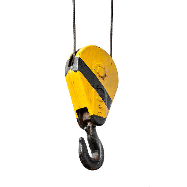Crane hook hanging on ropes isolated on white Crane hook hanging on steel ropes isolated on white background hook equipment stock pictures, royalty-free photos & images