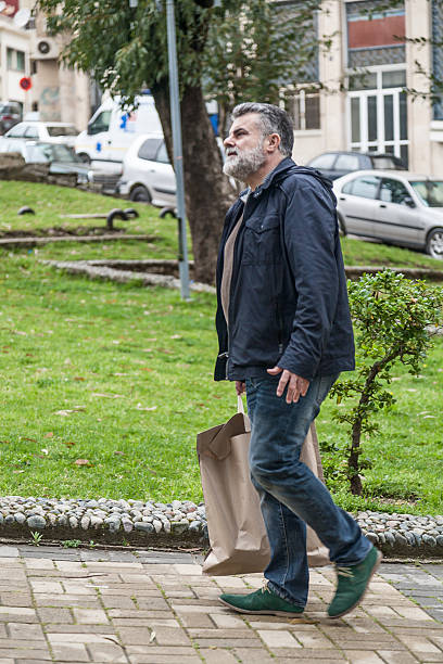 istock Attractive man with beard shopping 469122694