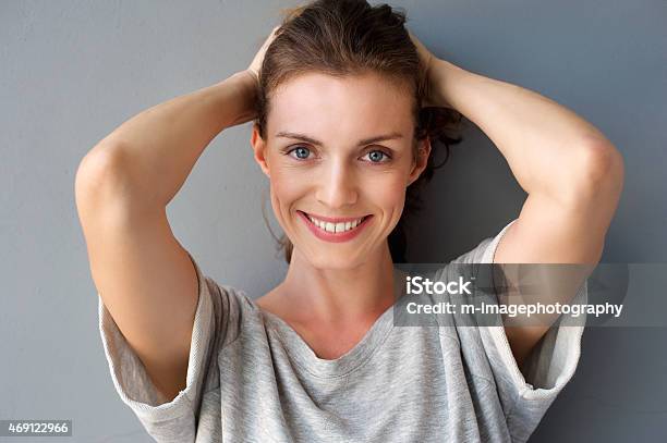 Happy Mid Adult Woman Smiling With Hands In Hair Stock Photo - Download Image Now - Women, One Woman Only, Human Face