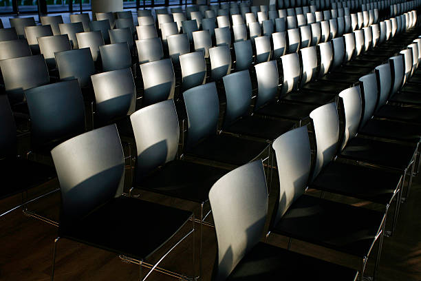 istock Rows of empty chairs prepared for an indoor event 469123506