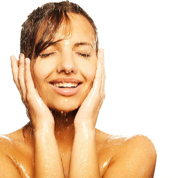istock woman face with water drop 469124150