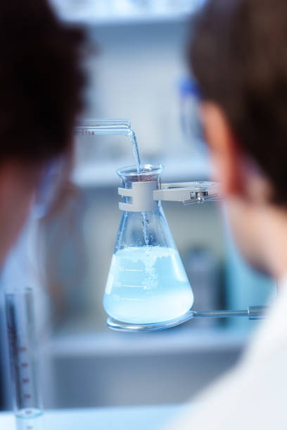 istock Scientists with Chemical Reaction Experiment in Chemistry Laboratory Class 469128552