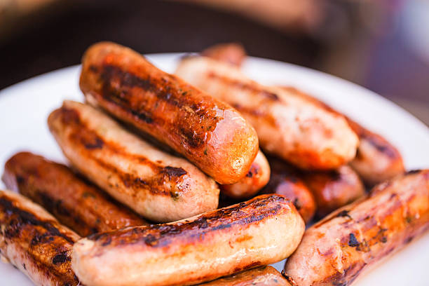 istock Barbecued beef and pork sausages on white plate 469129350