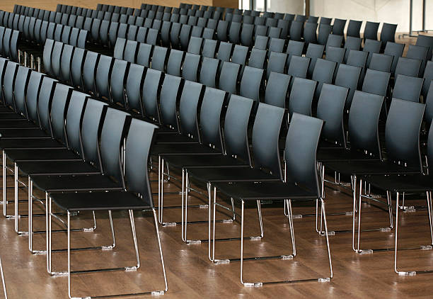 istock Endless rows of chairs in a modern conference hall 469130698