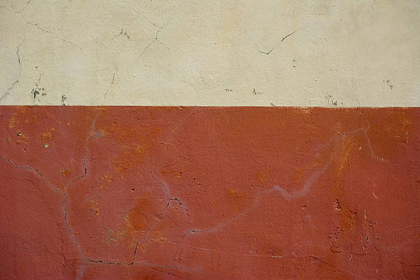 istock Coffee Creme and warm red colored old painted wall 469131334