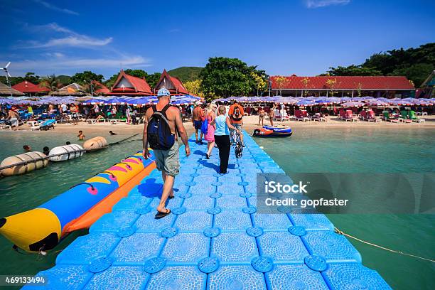 Tourists Walk On Floating Footpath In The Sea Stock Photo - Download Image Now - 2015, Backgrounds, Beach