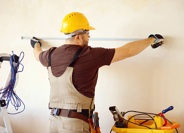 istock Male carpenter in working clothes in a construction workshop 469135636