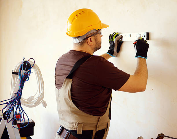 istock Male carpenter in working clothes in a construction workshop 469135638