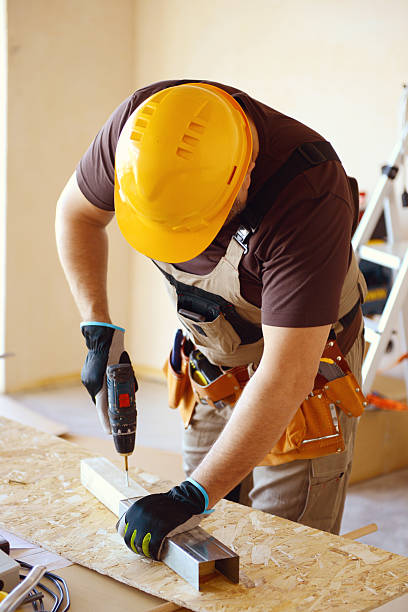 istock Male carpenter in working clothes in a construction workshop 469139414