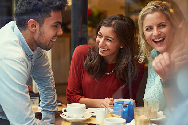 istock Group Of Friends In Caf Relaxing Together 469140076