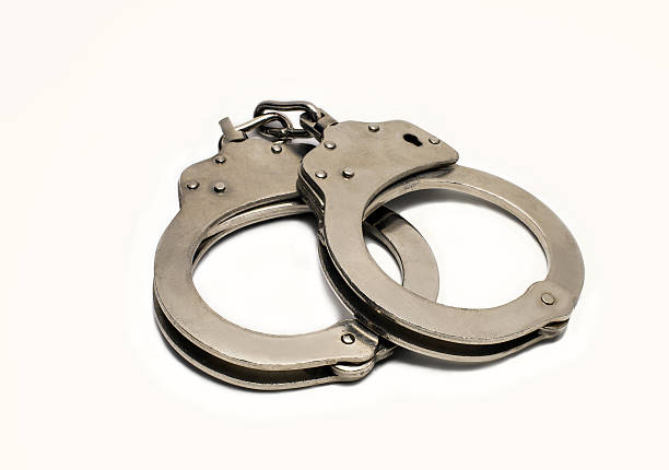 istock steel handcuffs on a white background 469142480