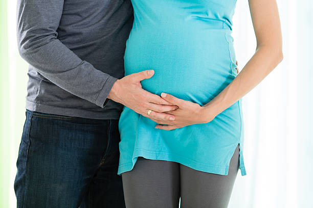 istock Happy young couple expecting a new baby 469144035