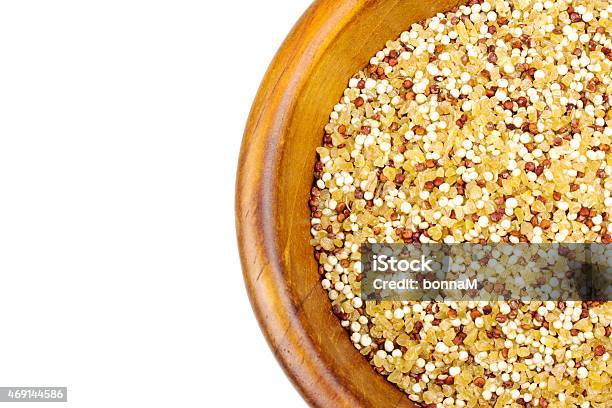 Quinoa Bulgur Mix In A Wooden Bowl Isolated On White Stock Photo - Download Image Now