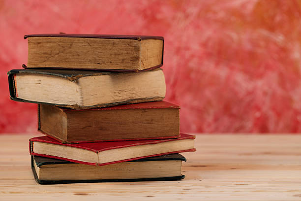 istock Vintage old books on wooden table 469145436