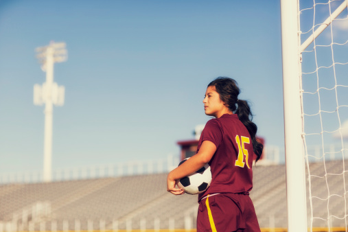 Portrait of a high school soccer player of Latin descent. 