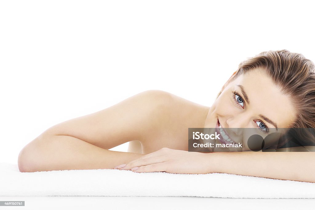 Natural woman A picture of a young woman resting her head on a towel over white background Women Stock Photo