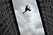 Man jumping over building