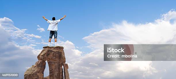 Winner Man Standing On The Top Of Mountain Stock Photo - Download Image Now - High Up, Men, Reaching