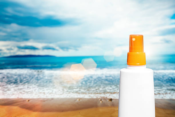 istock Sun Protection Cream Bottle On The Beach 469153842