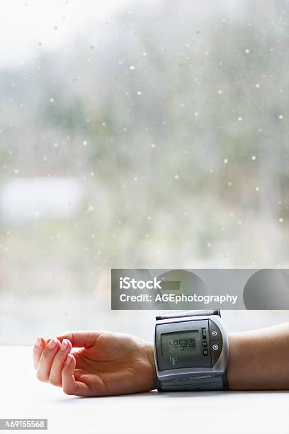 Womans Hand With Blood Pressure Measuring Device Stock Photo - Download Image Now - 2015, Adult, Analyzing