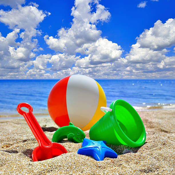 istock Baby Toys on beach sand 469156094