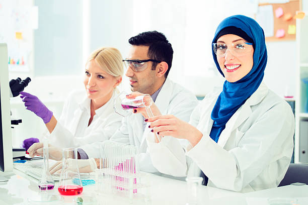 istock Group of multi ethnic scientists working in a lab. 469156179