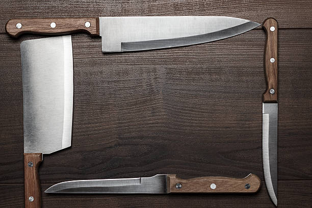 istock kitchen knifes on the brown wooden table 469157527