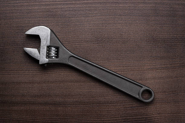 istock adjustable wrench on the wooden table 469158109