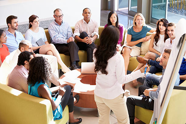 istock Businesswoman making presentation to others 469160313
