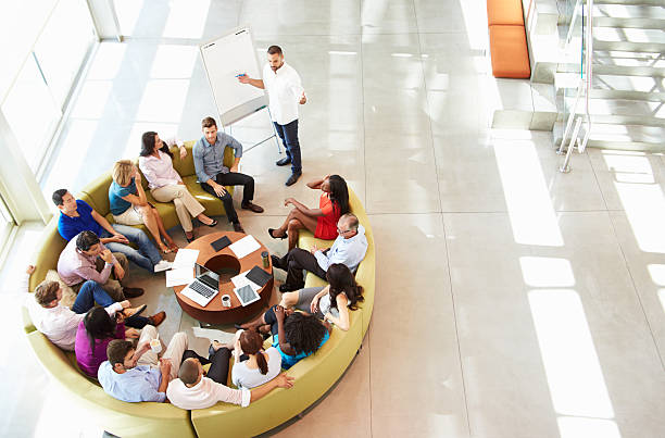 istock Businessman Making Presentation To Office Colleagues 469160715