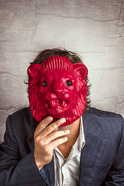 istock Business Monster Man using a red lion mask. 469163794