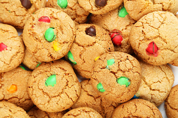 istock Cookies with colorful candy background 469164712