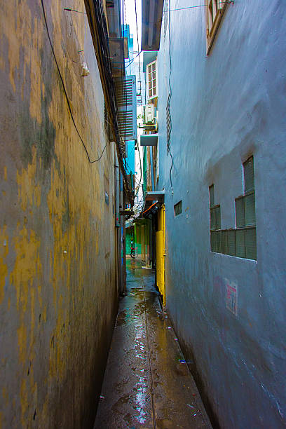 istock Dark, narrow alley in between two buildings 469164716